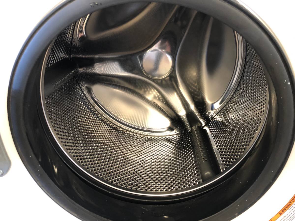 Washer repair technician in a Chula Vista laundry room